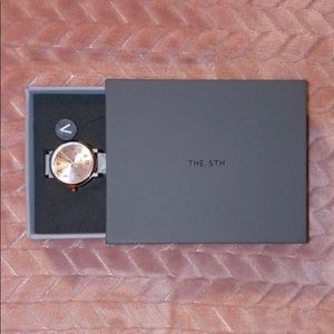 The fifth rose gold watch with grey strap